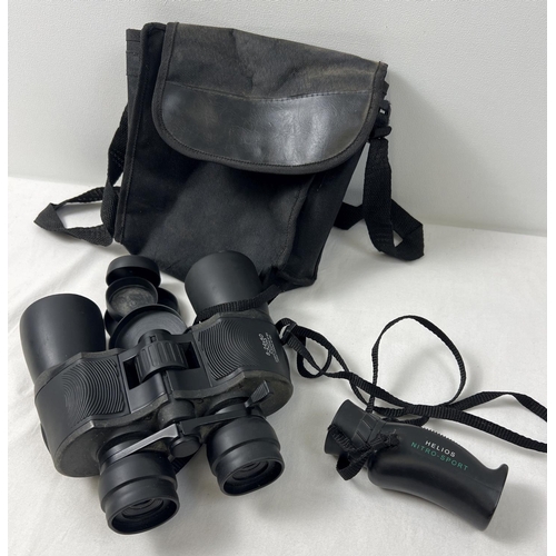 1332 - A cased set of 8-24 x 50 Zoom binoculars with lens caps. Together with a Helios Niro-Sport 8 x 25 wa... 