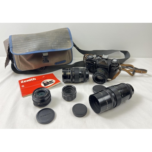 1333 - A vintage Zenit EM Camera with a collection of lenses, carry bag and handbook. Lenses comprise: Pent... 