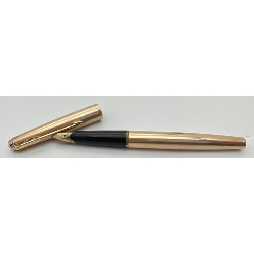 1179 - A vintage 12ct rolled gold cased Parker fountain pen with 14k gold nib. With fine engine turned chan... 