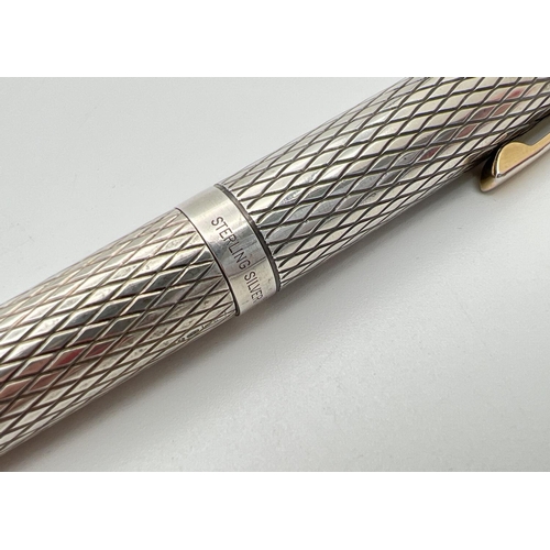 1180 - A vintage sterling silver cased Sheaffer fountain pen with 14k gold nib. Engraved criss-cross design... 