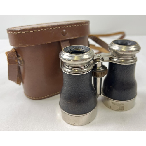 1336 - A leather cased set of vintage Le Jockey Club extending binoculars in chrome and black leather finis... 