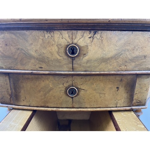 1499 - A Victorian walnut veneer sewing box on shaped and turned legs with ceramic castors. Lift up lid wit... 