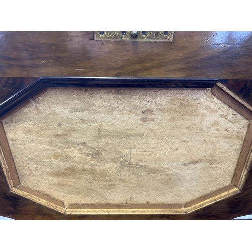 1499 - A Victorian walnut veneer sewing box on shaped and turned legs with ceramic castors. Lift up lid wit... 