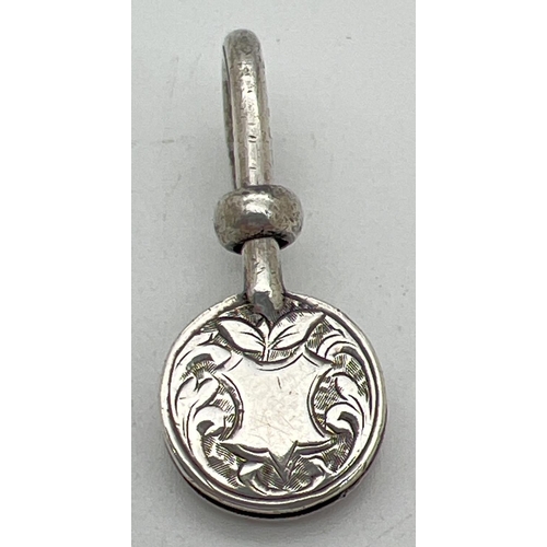 1157 - A Victorian silver napkin hook with engraved detail to circular clip. Decorative scroll & foliate de... 