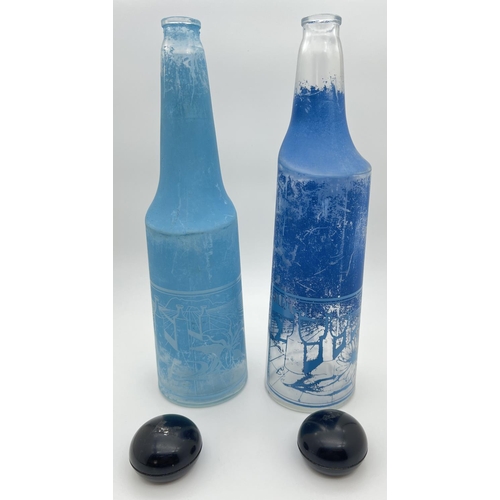 1299 - Two 1970's Salvador Dali for Rosso Antico aperitif bottles in blue tones, with serigraphic image. We... 