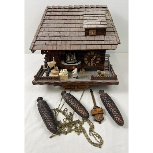 1254 - A wooden chalet style flour mill Cuckoo clock with pine cone weights by Schneider. Musical movement ... 