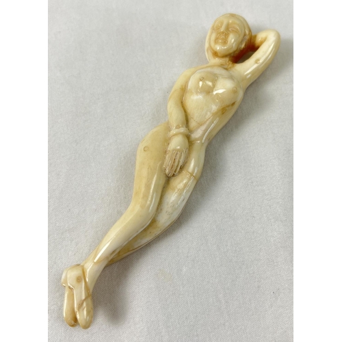 1425 - A small carved nude figure with polished finish, possibly bone. Approx. 13cm long.