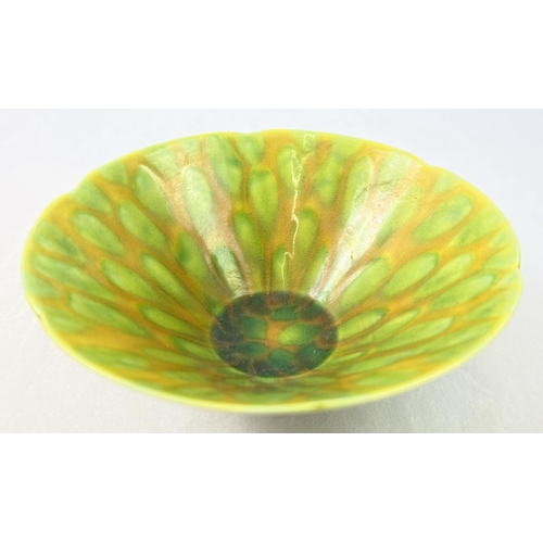 1317 - A Chinese ceramic bowl with yellow and green spotted design glaze and scalloped rim. Hand painted si... 