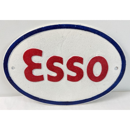 1382 - An Esso oval shaped painted cast iron wall plaque, in white blue & red. Approx. 22cm x 32.5cm.