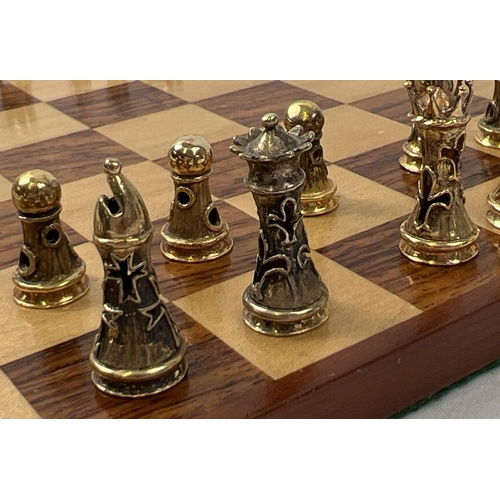 1162 - A cased silver chess set with silver and silver gilt playing pieces and a wooden chessboard. Each pi... 