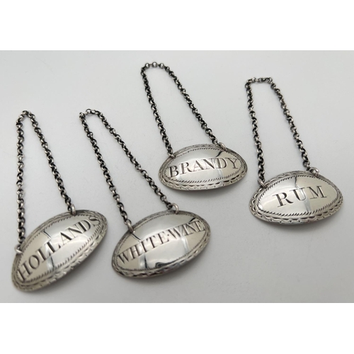 1168 - A set of 4 George III silver decanter labels - Brandy, Rum, Hollands & White Wine. Oval shaped with ... 