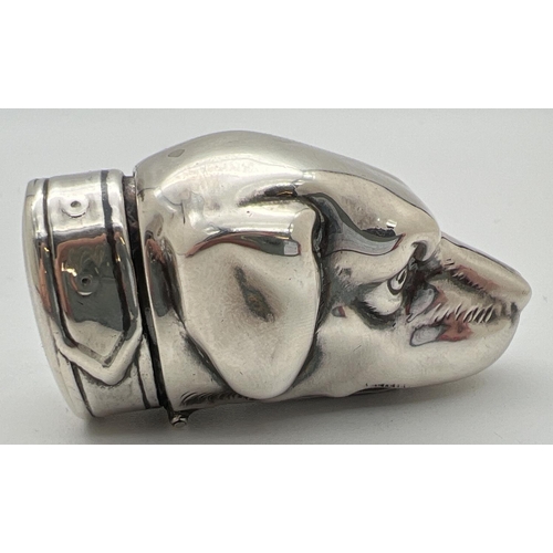 1171 - A novelty silver vesta case modelled as a dogs head, with striking panel to underside. Hinged lid in... 