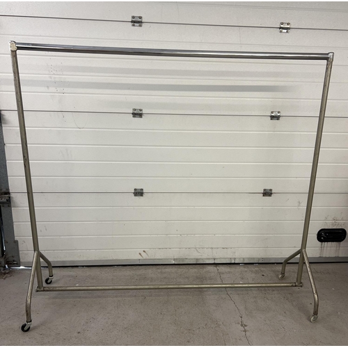 1429 - Heavy duty silver coloured metal clothes rail on wheels. Approx. 166cm tall and 184cm Long.