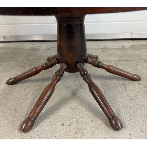 1511 - A vintage dark wood and glass topped coffee table made from a spoked wheel. Approx. 42cm tall x 75cm... 