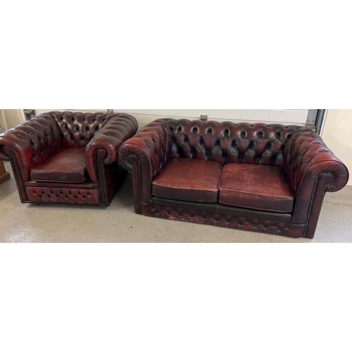 1512 - A 2 seater oxblood leather Chesterfield sofa with button back and stud detail, with matching armchai... 