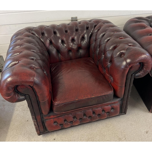 1512 - A 2 seater oxblood leather Chesterfield sofa with button back and stud detail, with matching armchai... 