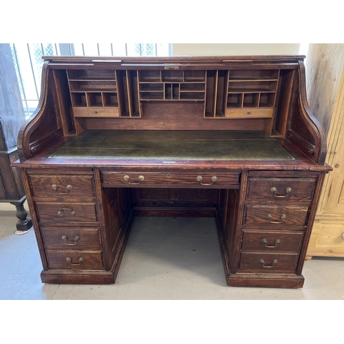 1514 - An Edwardian dark oak S bend roll top desk with 4 drawer twin pedestals. Interior has green leather ... 