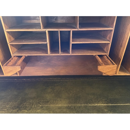 1514 - An Edwardian dark oak S bend roll top desk with 4 drawer twin pedestals. Interior has green leather ... 