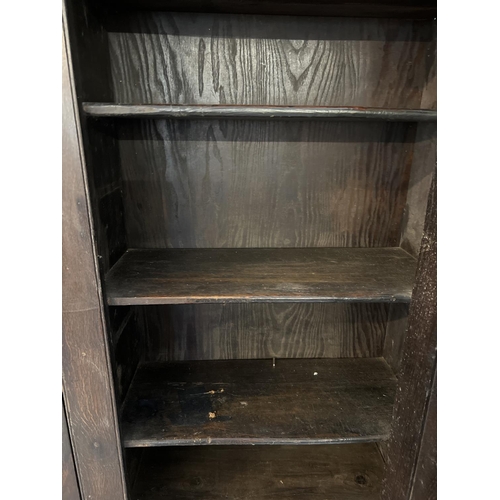 1518 - A Georgian dark wood 4 door cupboard with fixed interior shelves, raised on turned front legs. Origi... 