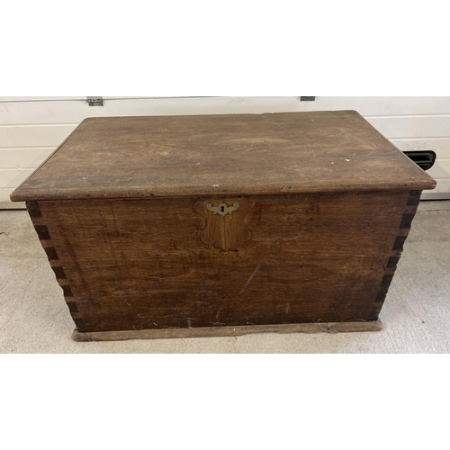 1519 - A large antique dark wood blanket chest with brass handles to each end (both a/f). Decorative brass ... 