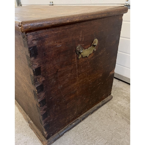 1519 - A large antique dark wood blanket chest with brass handles to each end (both a/f). Decorative brass ... 