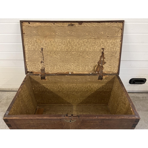 1519 - A large antique dark wood blanket chest with brass handles to each end (both a/f). Decorative brass ... 