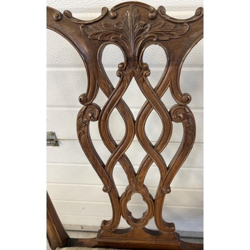 1521 - A late Victorian 2 seater satin wood settee with later striped upholstered seat. Ornately carved and... 