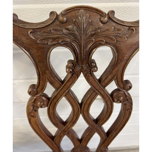 1521 - A late Victorian 2 seater satin wood settee with later striped upholstered seat. Ornately carved and... 