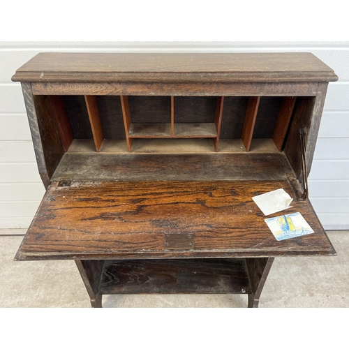 1526 - A vintage dark wood bureau with undershelf and drawer. Interior stationary compartments to top secti... 