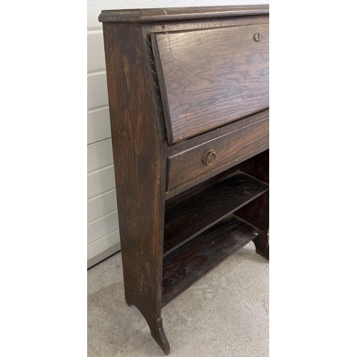 1526 - A vintage dark wood bureau with undershelf and drawer. Interior stationary compartments to top secti... 