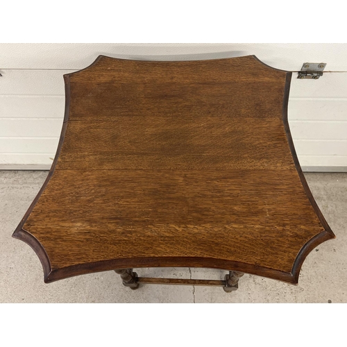 1532 - A dark wood vintage occasional table with turned legs and shaped top. Approx. 76cm x 74cm.