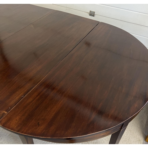 1534 - A 3 piece Georgian mahogany dining table with drop leaf central table and 2 'D' ends. Raised on squa... 