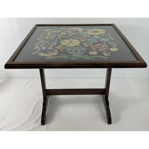 1536 - An Art Deco dark wood framed tilt top firescreen table with floral design needlepoint panel behind g... 