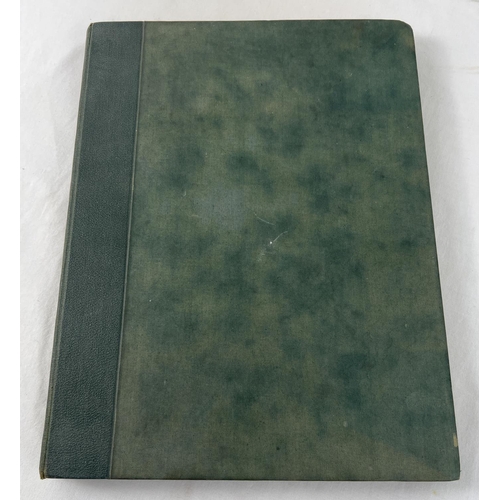 1330 - A late Victorian Scraps album containing greeting cards, postcards and scraps. In a dark green cloth... 