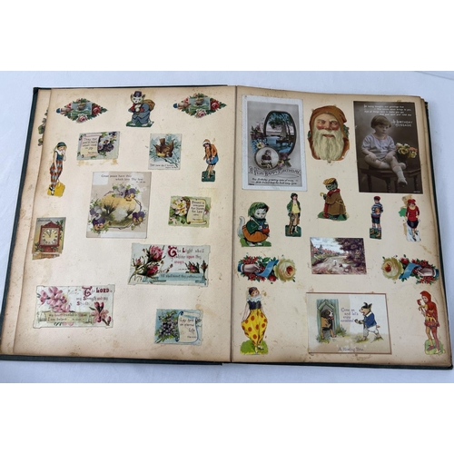 1330 - A late Victorian Scraps album containing greeting cards, postcards and scraps. In a dark green cloth... 