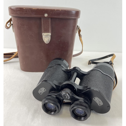 1339 - A vintage pair of Carl Zeiss Jena Jenoptem 10 x 50w binoculars in a breather leather case with shoul... 