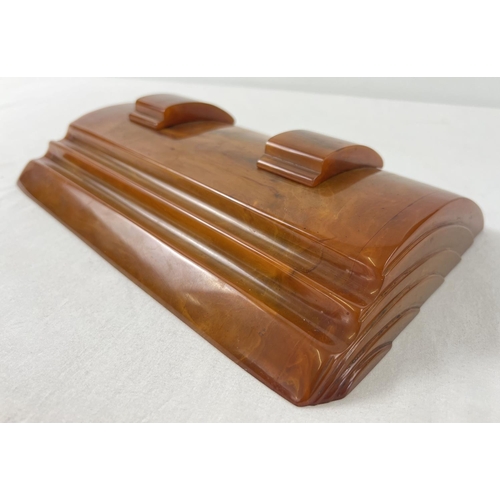 1440 - An Art Deco Carvacraft butterscotch bakelite desk standish with inkwells for black & red ink. Slidin... 