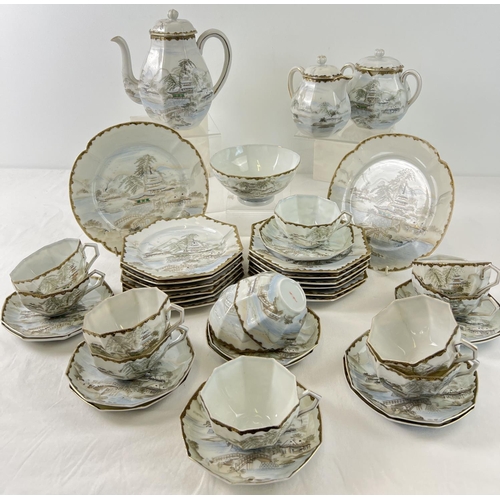 1280 - A late Victorian Japanese eggshell porcelain 12 setting teaset with handpainted scenic design and gi... 