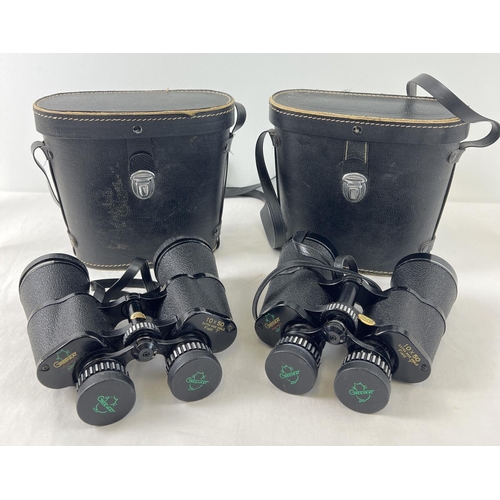 1340 - 2 sets of 10 x 50 extra wide angle, field binoculars by Greenkat. With carry cases.