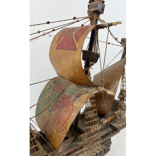 1443 - A wooden hand made model of the Santa Maria Spanish Galleon. Hand painted detail to all sails. Appro... 