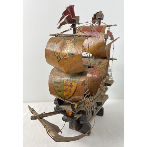 1443 - A wooden hand made model of the Santa Maria Spanish Galleon. Hand painted detail to all sails. Appro... 