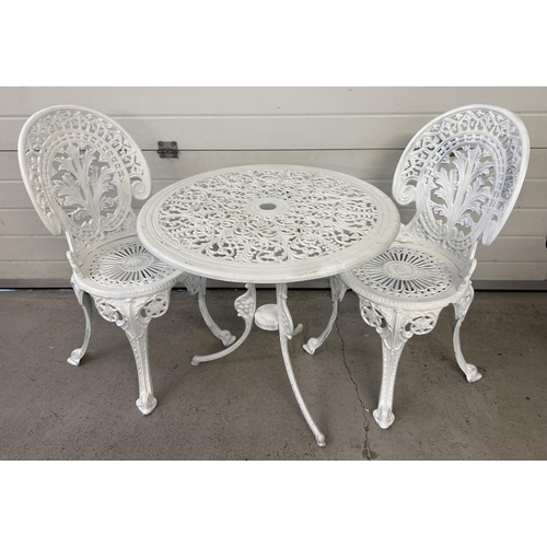 1485 - A cast metal 2 seat garden bistro set, painted white, with decorative pierced work detail. Table app... 