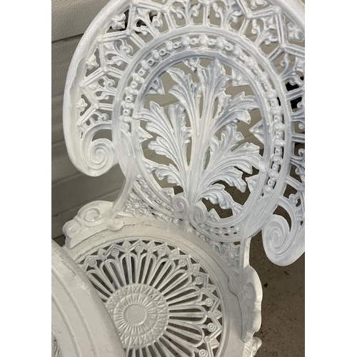 1485 - A cast metal 2 seat garden bistro set, painted white, with decorative pierced work detail. Table app... 