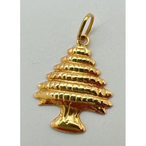 2 - An 18ct gold pendant in the shape of a tree. Gold mark to hanging bale. Approx. 3cm x 2cm (including... 