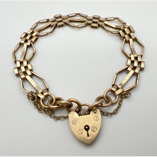 11 - A 9ct gold vintage 3 bar gate style bracelet with padlock clasp and safety chain. Gold marks to back... 