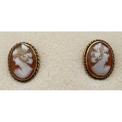 12 - A pair of 9ct gold oval shaped cameo stud style screw back earrings with rope design to mounts. Each... 