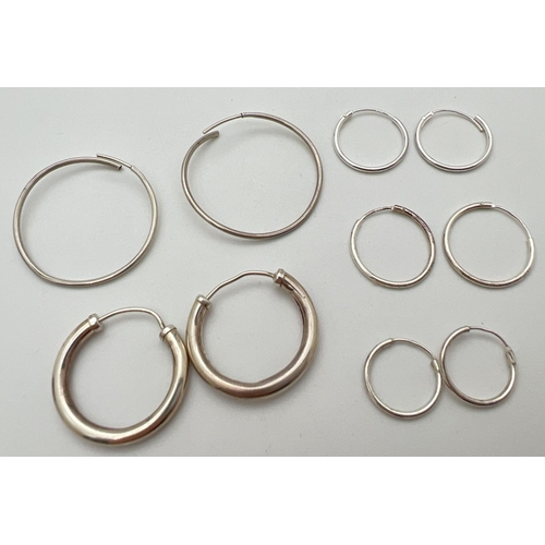 18 - 5 pairs of silver hoop earrings in varying sizes. Largest pair approx. 3cm diameter. All have silver... 