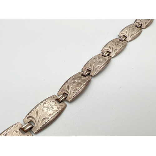 19 - A vintage silver 8 panel bracelet with flower engraved pattern to each panel and push clasp. Silver ... 