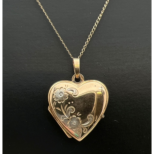 22 - A 9ct gold heart shaped locket with floral detail to front, on an 18