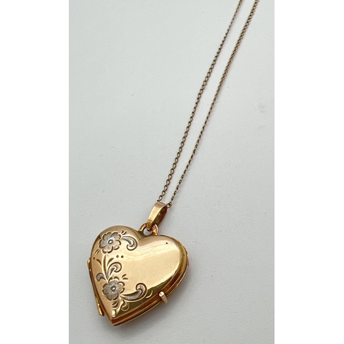 22 - A 9ct gold heart shaped locket with floral detail to front, on an 18